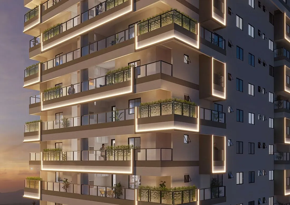 Fachada iluminada do Residencial Park Avenue, torre única na Vila Guilhermina, Praia Grande